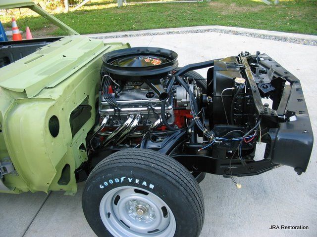 A goodyear tire is on the side of a car