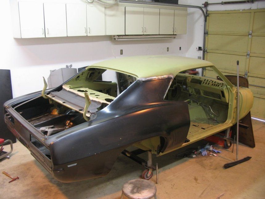 A car that is being built in a garage