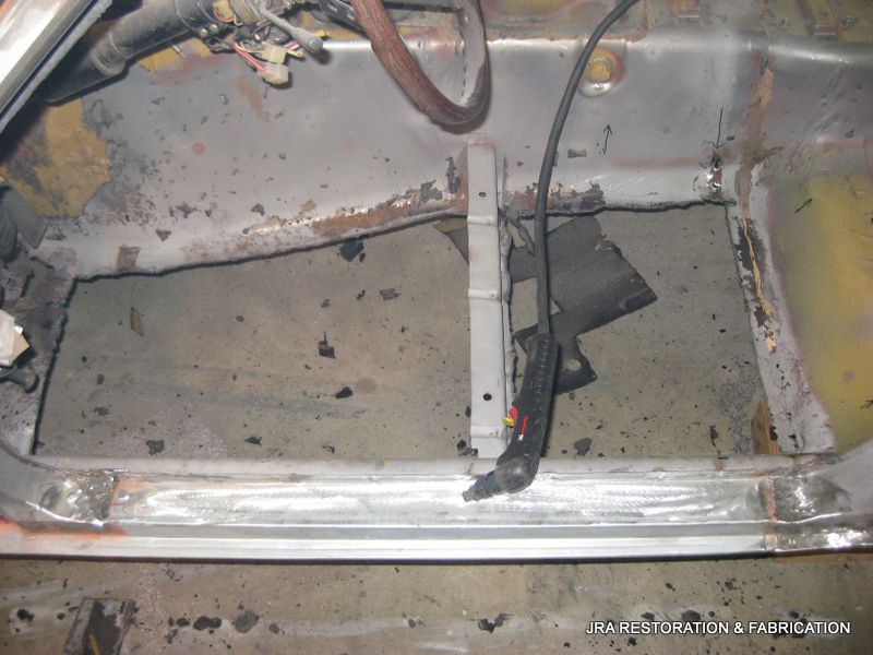 A picture of the inside of a car taken by a car restoration company