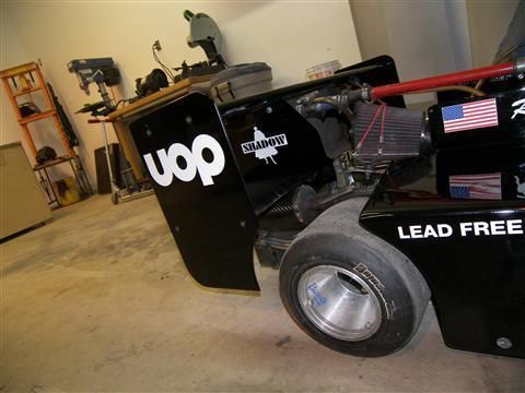 A black lawn mower that says lead free on it