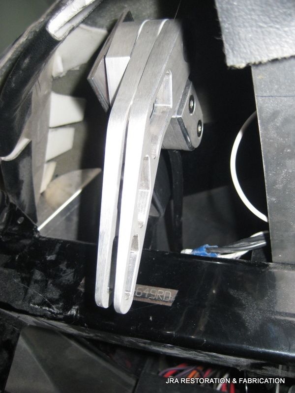 A close up of a piece of metal that says jra restoration & fabrication