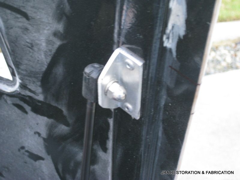 A close up of a door with the words architecture & fabrication on the bottom