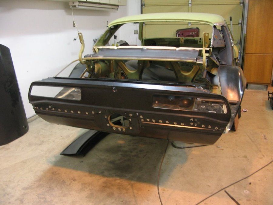 A car that is being built in a garage