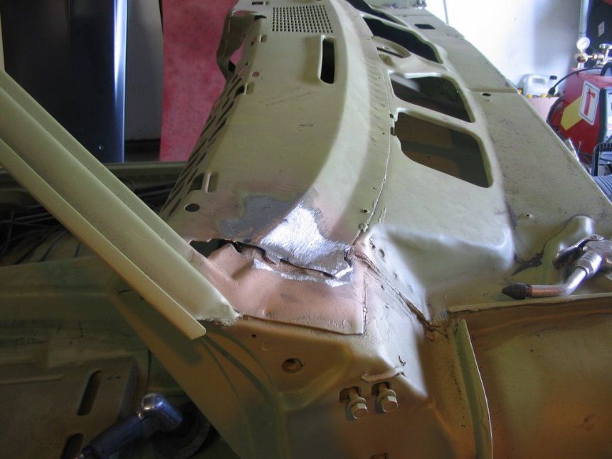 A car that has been damaged in a garage