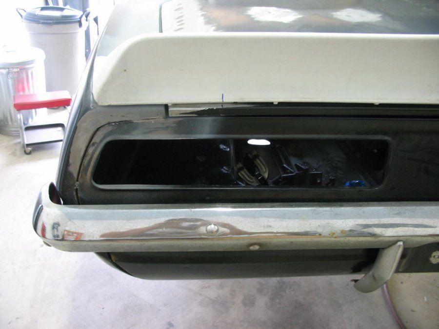 A close up of a car 's rear bumper and trunk