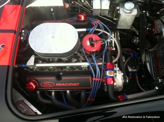 A close up of a ford racing engine