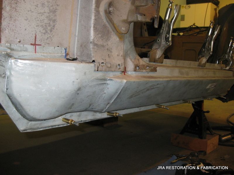A picture of a car being restored by jra restoration and fabrication