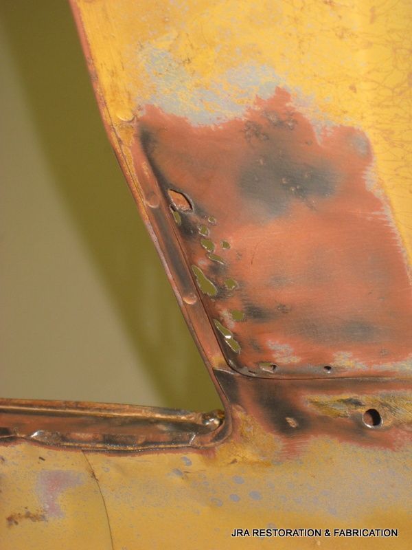 A close up of a piece of metal with rust on it.