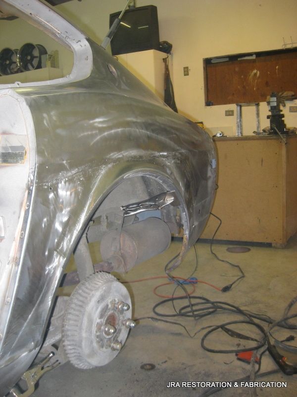 A car that is being worked on in a garage