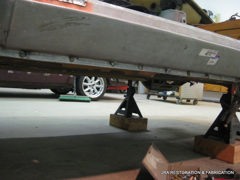 A car is being worked on by a company called usa restoration & fabrication