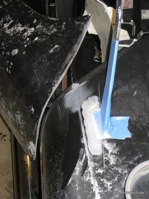 A piece of blue tape is on a piece of metal