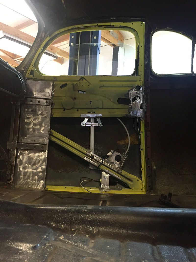 The inside of a car with a yellow door