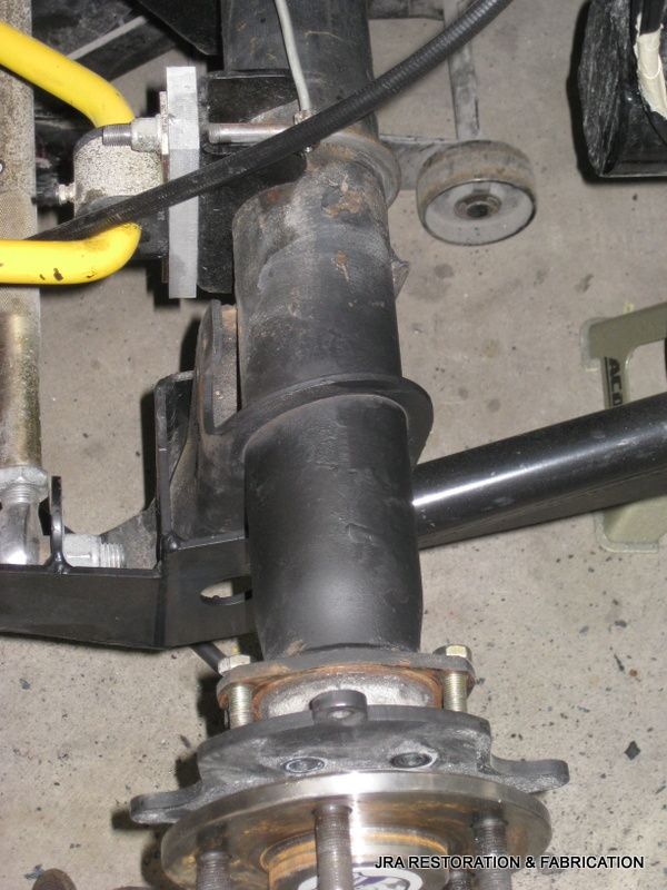 A close up of a piece of metal that says ' suspension & fabrication ' on it