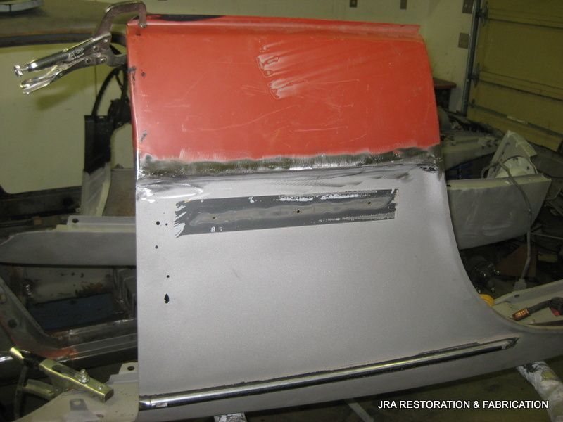 A piece of metal is sitting on a table with the words jra restoration & fabrication on the bottom