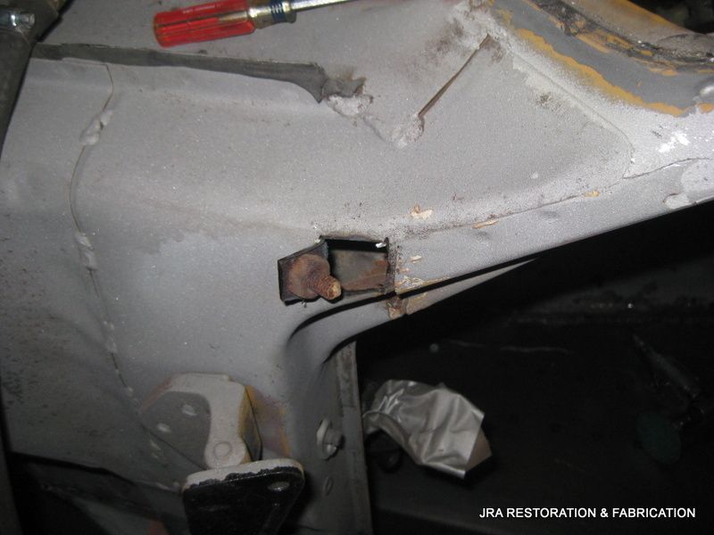 A close up of a piece of metal that says jra restoration & fabrication