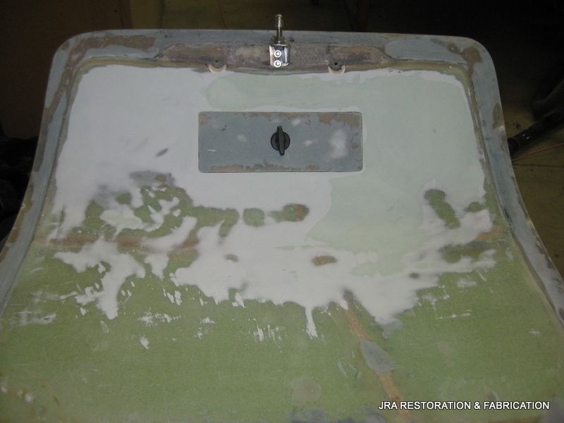 The back of a car is covered in white paint.