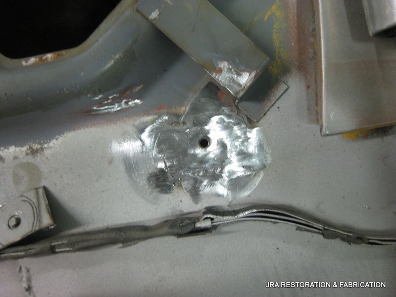 A close up of a piece of metal with a hole in it.