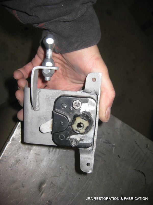 A person is holding a piece of metal in their hand