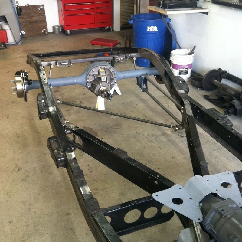 A blue trash can with the word rs on it