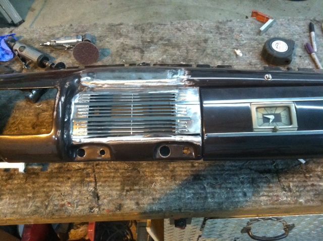 A dashboard is being worked on on a wooden table