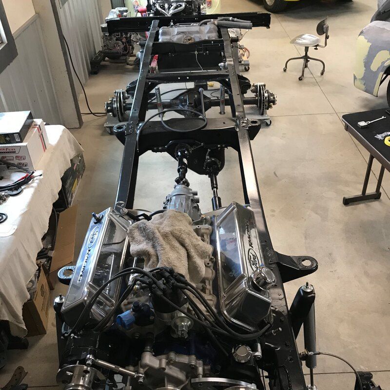 A car engine is being worked on in a garage