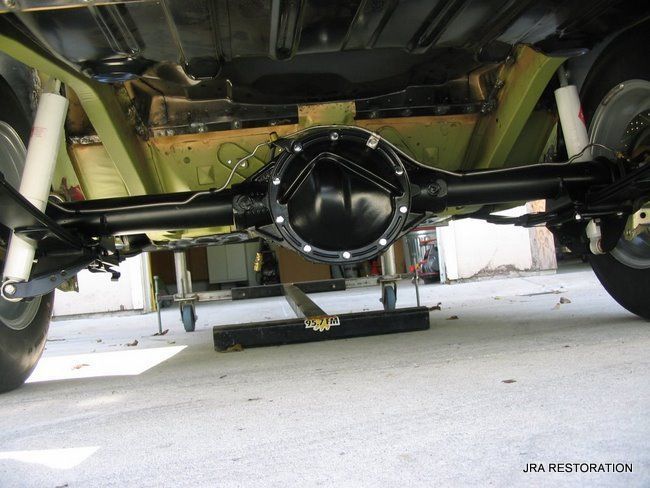 The rear end of a car is being restored by jra restoration