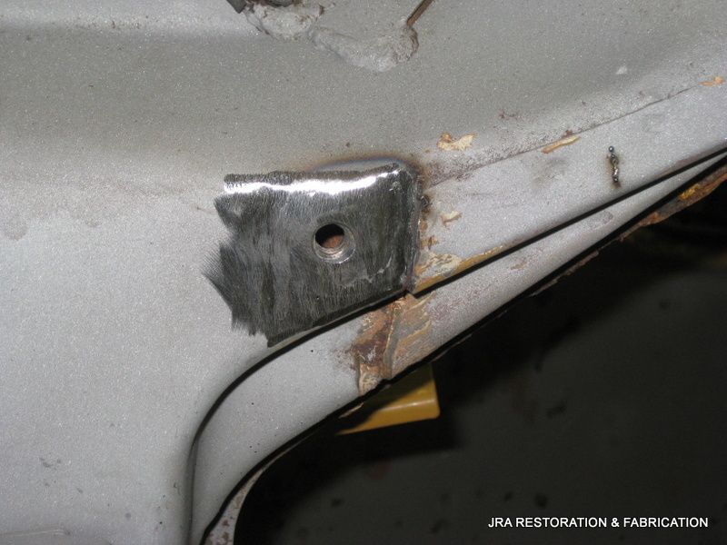 A piece of metal with a hole in it is being restored by jra restoration & fabrication