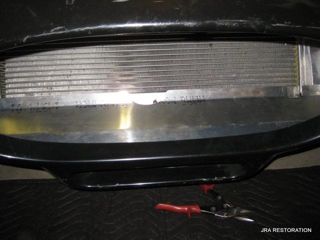 A close up of a radiator on a black car