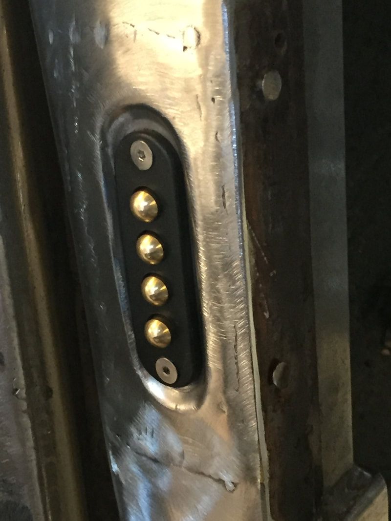 A close up of a metal object with buttons on it