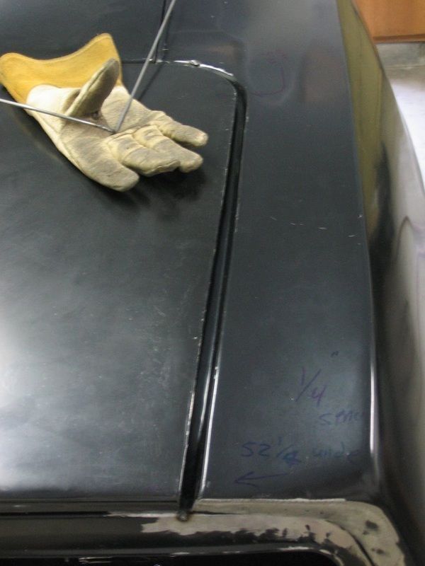 A pair of gloves laying on top of a black surface