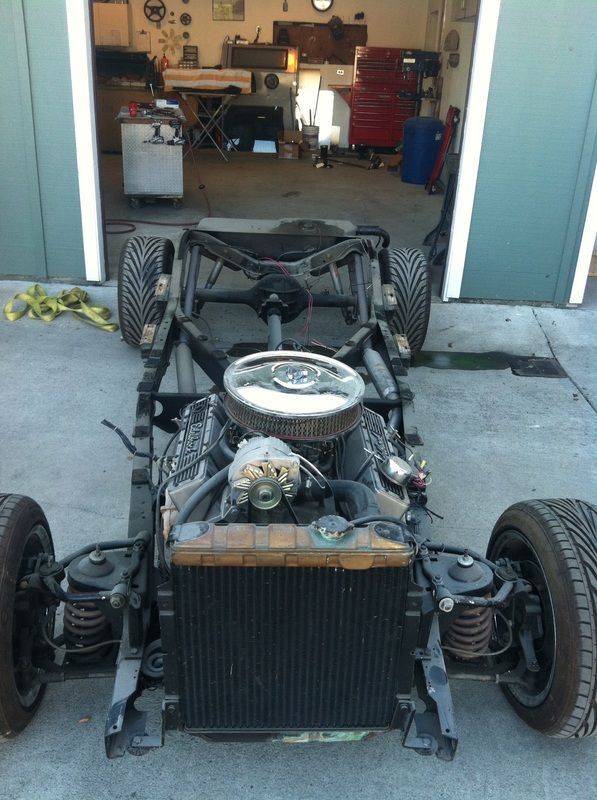 A car that is being built in a garage