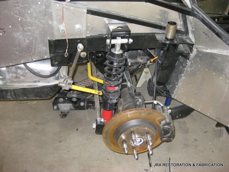 A close up of a car suspension with the word restoration on the bottom