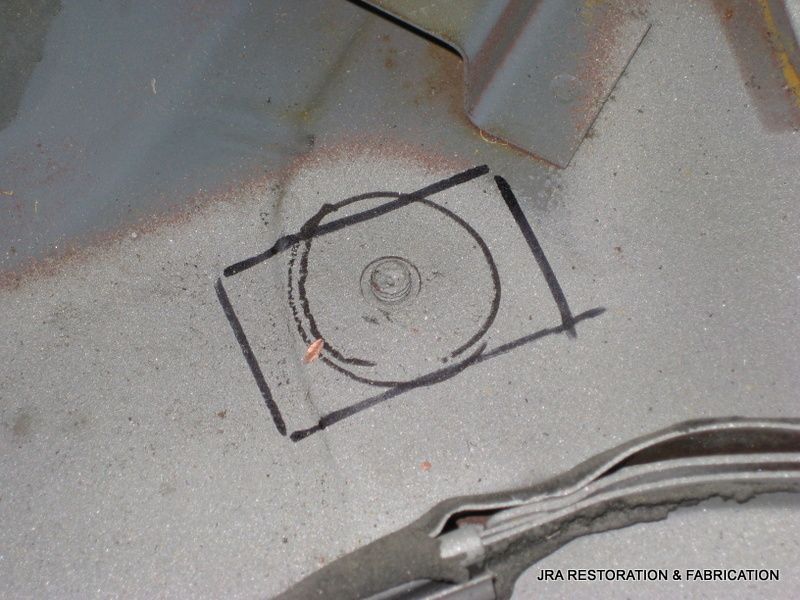 A drawing of a camera on a piece of metal