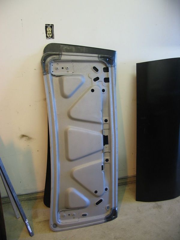 A piece of metal that looks like a triangle is sitting on the floor