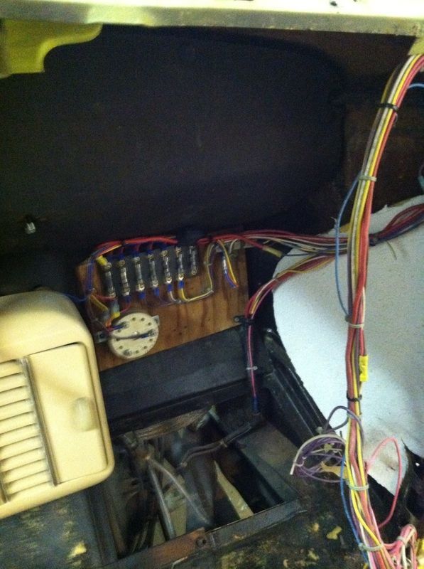 A bunch of wires are connected to a box with a clock on it