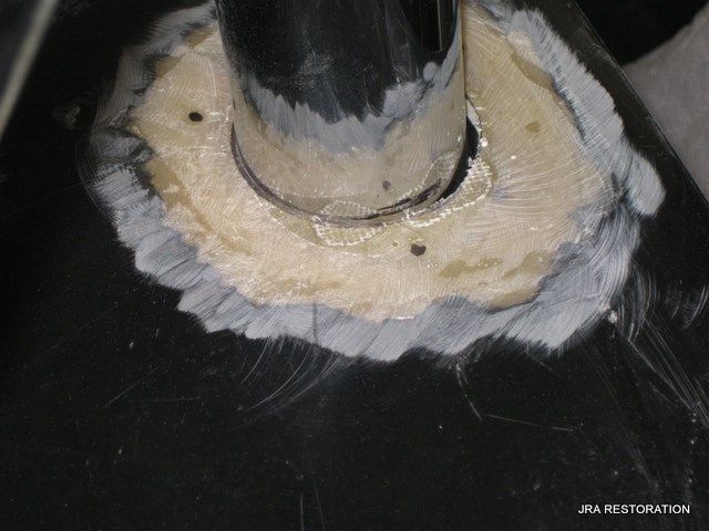 A close up of a hole in a pipe that says jba restoration on the bottom