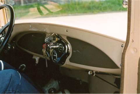 A close up of the dashboard of an old car