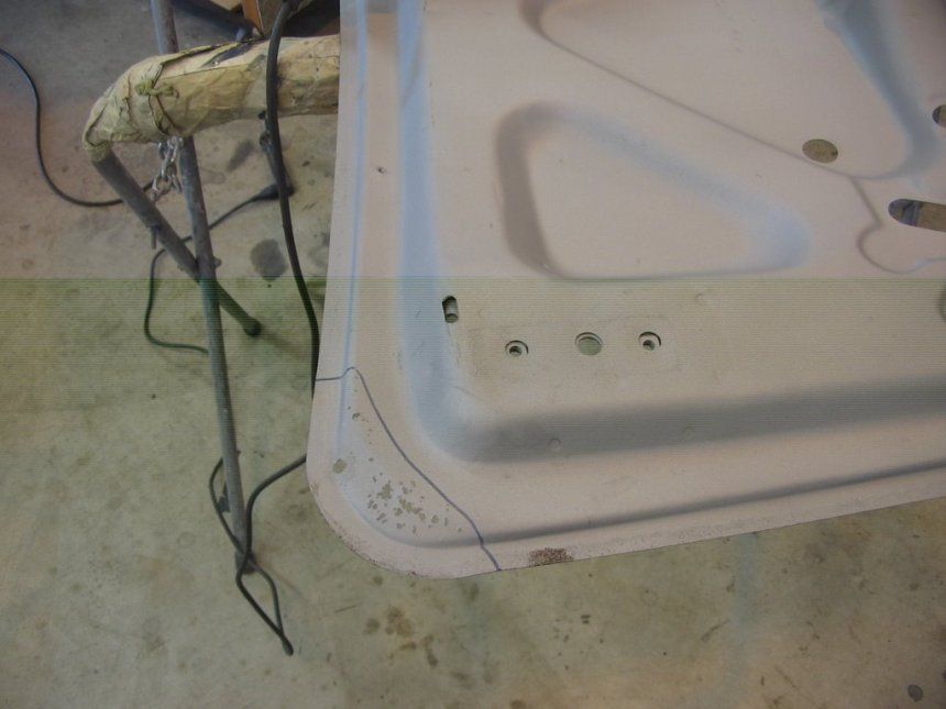 A white container with a few holes in it