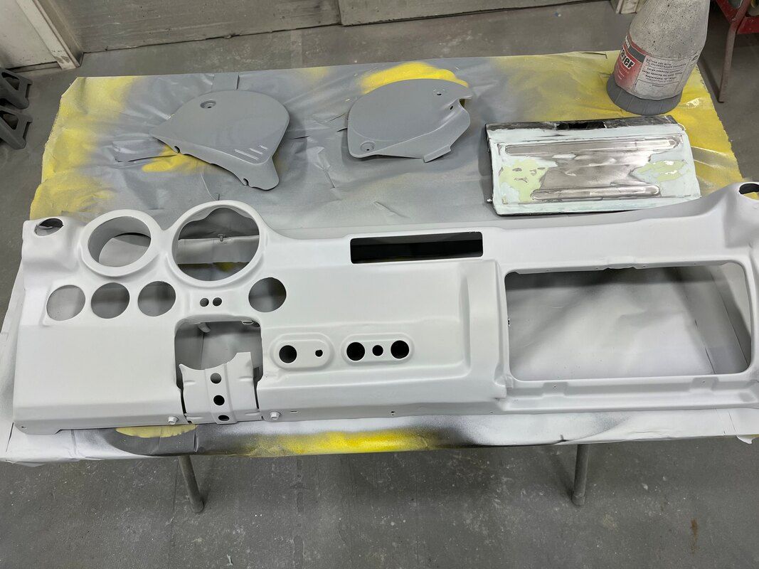 A white dashboard is sitting on top of a table.