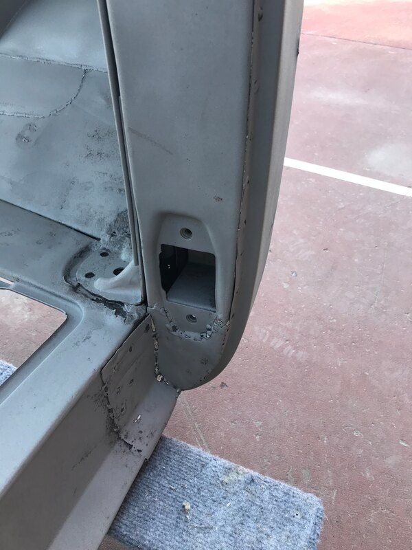 A close up of a piece of metal sitting on top of a concrete surface.