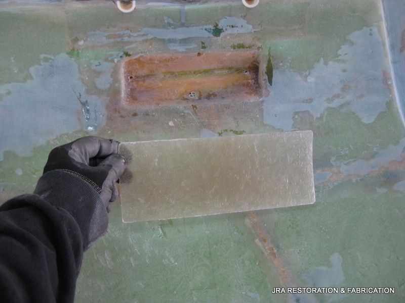 A person is holding a piece of plastic in their hand.