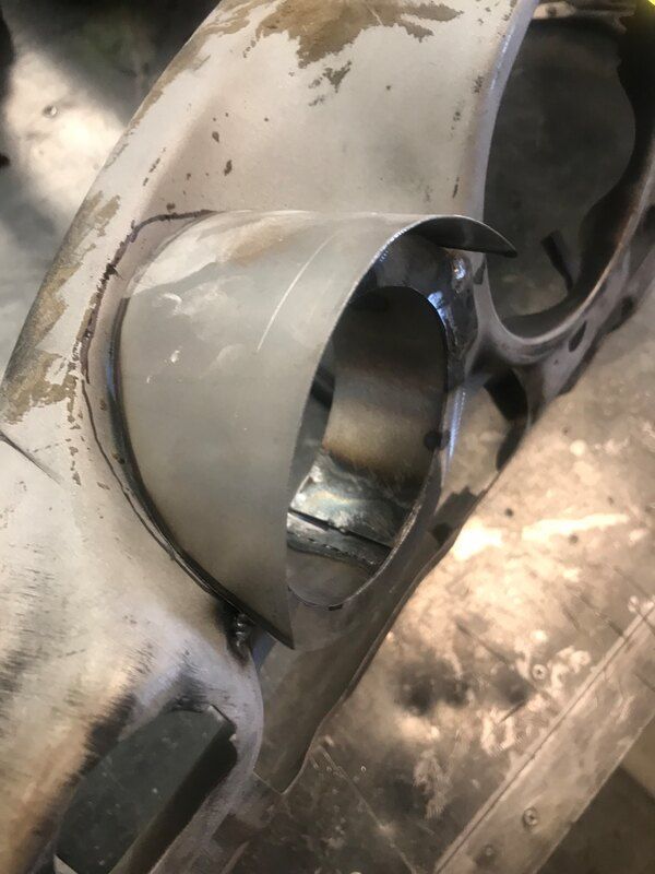 A close up of a metal object with a hole in it.