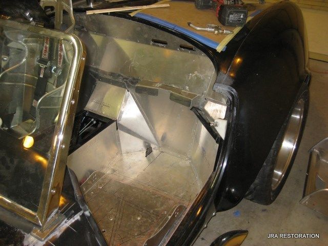 A black car with the word par restoration on the bottom