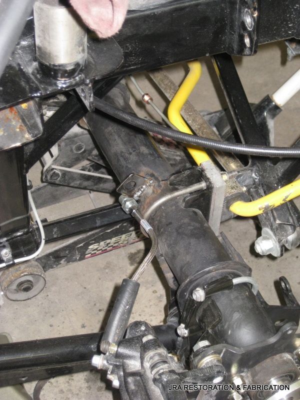 A close up of a black and yellow hose on a vehicle