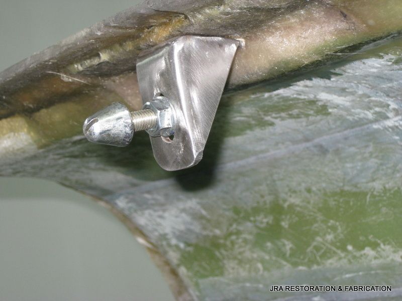 A close up of a metal bracket on a piece of metal