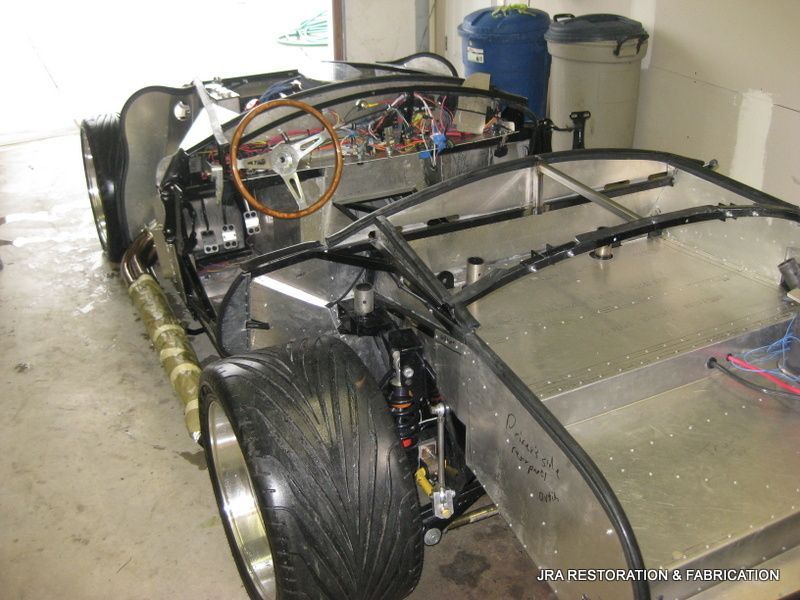 A car that is being built in a garage