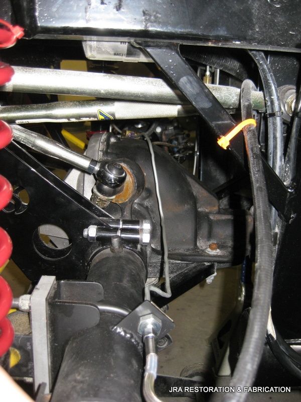 A close up of the underside of a vehicle with jra restoration written on the bottom