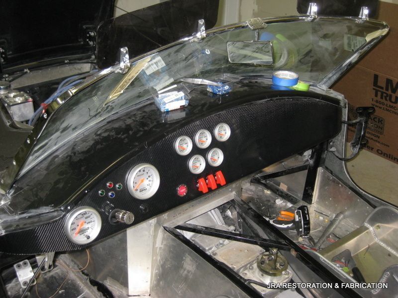 A dashboard of a car with a box in the background that says lm