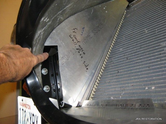 A person is holding a piece of metal with a california license plate