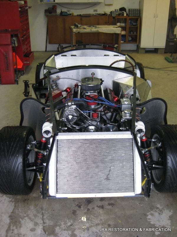 A race car is being built in a garage